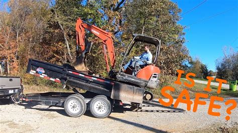 mini excavator loading dumpster|mini hauling in dump trailers.